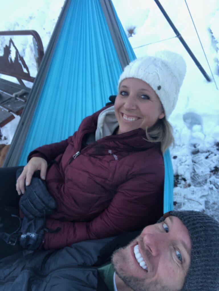 Kristen and Cal in a hammock in the snow
